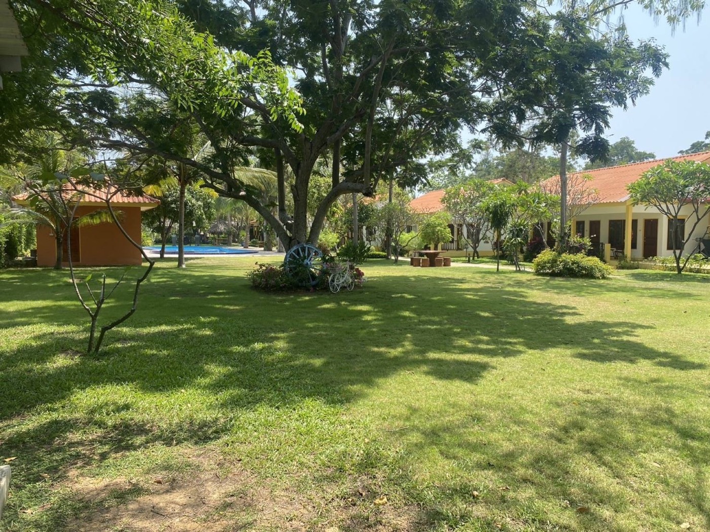 Green gardens and guest buildings on the property